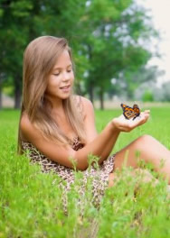 beautiful girl releases monarch butterfly near Virginia beach.