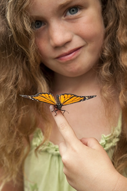girl enjoying a monarch butterfly release in louisiana.